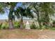 Beautiful palm tree and long dock offer access to the serene waterfront, perfect for boating at 146 Rivers Edge Way, Wando, SC 29492