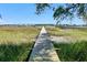 Scenic view down dock overlooking water and bridge in the distance at 146 Rivers Edge Way, Wando, SC 29492