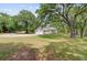 A lovely home with a two-car garage, expansive lawn, and lush, mature trees at 146 Rivers Edge Way, Wando, SC 29492