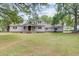 Charming home with a large front yard, well-maintained landscaping and mature trees at 146 Rivers Edge Way, Wando, SC 29492