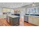 Spacious kitchen boasts a large island, stainless steel appliances, and views to the dining area at 146 Rivers Edge Way, Wando, SC 29492
