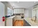 Well-lit kitchen featuring granite countertops, a stainless steel dishwasher, and ample cabinet space at 146 Rivers Edge Way, Wando, SC 29492