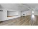 Open-concept living room with hardwood floors, built-in shelving, and vaulted ceilings at 146 Rivers Edge Way, Wando, SC 29492