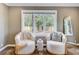 Cozy sitting area with large windows overlooking backyard at 146 Rivers Edge Way, Wando, SC 29492