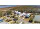 An elevated view shows stylish homes with manicured lawns, circular driveways, and mature trees at 1604 Bernier Commons, Johns Island, SC 29455
