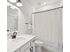 Modern bathroom with a white vanity, black fixtures, subway tile, and a shower with a curtain at 1604 Bernier Commons, Johns Island, SC 29455