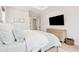 Bright bedroom with a television over a dresser, white walls and trim, and plenty of natural light at 1604 Bernier Commons, Johns Island, SC 29455