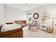 Well lit Bedroom featuring a crib, changing table, and a comfy chair at 1604 Bernier Commons, Johns Island, SC 29455