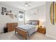 Comfortable bedroom featuring a wooden bed frame, dresser, and surf board leaning against the wall at 1604 Bernier Commons, Johns Island, SC 29455