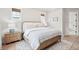 Comfortable bedroom with a queen bed, wicker accents, two windows, and a soft blue and white color palette at 1604 Bernier Commons, Johns Island, SC 29455