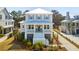 Charming two-story home with a large front porch, white railings, and manicured landscaping at 1604 Bernier Commons, Johns Island, SC 29455