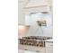 Close-up of a KitchenAid range and pot filler offers a chef-friendly space with modern finishes at 1604 Bernier Commons, Johns Island, SC 29455
