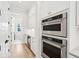 Kitchen area with stainless steel double oven, wine cooler, and ample storage at 1604 Bernier Commons, Johns Island, SC 29455
