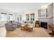 Cozy living room with a fireplace, comfortable seating, and ample natural light at 1604 Bernier Commons, Johns Island, SC 29455
