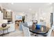 Spacious living area featuring an open layout with hardwood floors, fireplace, and a natural light-filled dining area at 1604 Bernier Commons, Johns Island, SC 29455