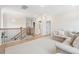 Upstairs living area with neutral furniture, wood floors, and a view of the staircase and second floor hallway at 1604 Bernier Commons, Johns Island, SC 29455