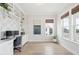 Bright home office with custom built-ins, hardwood floors, and two windows with natural light at 1604 Bernier Commons, Johns Island, SC 29455