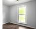 Light-filled bedroom featuring hardwood floors, neutral walls, and a large window with natural light at 166 Braly Dr, Summerville, SC 29485