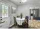 Cozy dining nook featuring a round table, four chairs, and stainless steel refrigerator next to the kitchen at 166 Braly Dr, Summerville, SC 29485