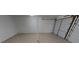 Spacious garage with a clean, bright interior and functional roll-up door for secure parking at 166 Braly Dr, Summerville, SC 29485