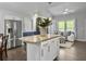 Modern kitchen island with granite countertops and bar stools, open to living room, great for entertaining at 166 Braly Dr, Summerville, SC 29485
