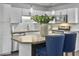 Stylish kitchen with white cabinetry, granite countertops, modern appliances, and a kitchen island with barstools at 166 Braly Dr, Summerville, SC 29485