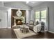 Inviting living room with fireplace, a plush sofa, and an ottoman, creating a perfect space for entertaining at 166 Braly Dr, Summerville, SC 29485