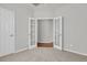 Cozy bedroom with plush carpeting and charming French doors leading to another room at 170 Sea Lavender Ln, Summerville, SC 29486