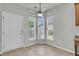 Breakfast nook with a modern ceiling fan and a trio of windows providing ample natural light at 170 Sea Lavender Ln, Summerville, SC 29486