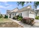 Charming home with manicured landscaping, a covered entrance, and attached two car garage at 170 Sea Lavender Ln, Summerville, SC 29486