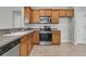 Spacious kitchen equipped with stainless steel appliances, generous counter space, and wood cabinets at 170 Sea Lavender Ln, Summerville, SC 29486