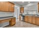 Functional kitchen with wood cabinets, stainless steel appliances, and a view to a dining space at 170 Sea Lavender Ln, Summerville, SC 29486