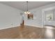 Open-concept living room with hardwood floors and view of the kitchen at 170 Sea Lavender Ln, Summerville, SC 29486