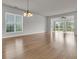 Bright living room with hardwood floors and a large window at 170 Sea Lavender Ln, Summerville, SC 29486