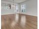 Open-concept living room with hardwood floors and neutral paint at 170 Sea Lavender Ln, Summerville, SC 29486