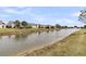 Scenic view of a tranquil pond reflecting the surrounding community, enhancing the neighborhood's charm at 170 Sea Lavender Ln, Summerville, SC 29486