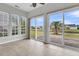 Bright sun room with tile floors and large windows at 170 Sea Lavender Ln, Summerville, SC 29486