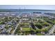 Scenic aerial of residential area near waterfront, with modern bridge, shipping port, and neatly planned neighborhood at 172 Saint Philip St # F, Charleston, SC 29403