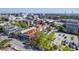 Aerial view of a charming neighborhood with a mix of residential buildings, trees, and street parking in a bustling city at 172 Saint Philip St # F, Charleston, SC 29403