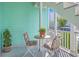 A cozy balcony seating area with flowers at 172 Saint Philip St # F, Charleston, SC 29403