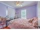 Comfortable bedroom with a large bed, desk, and ample natural light, creating a relaxing atmosphere at 172 Saint Philip St # F, Charleston, SC 29403