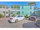 Charming two-story home with a gravel driveway and a light blue exterior at 172 Saint Philip St # F, Charleston, SC 29403