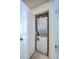 Compact laundry closet featuring a stacked washer and dryer unit, ideal for space-saving convenience at 172 Saint Philip St # F, Charleston, SC 29403