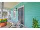 Porch with seating and plants near the entrance at 172 Saint Philip St # F, Charleston, SC 29403