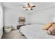 Bright bedroom features a ceiling fan, neutral color palette, and plush carpeting for a comfortable retreat at 188 Midlands Pkwy # 507, Summerville, SC 29485