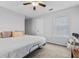 Cozy bedroom features plush carpet, a ceiling fan, and natural light, creating a comfortable and inviting space at 188 Midlands Pkwy # 507, Summerville, SC 29485
