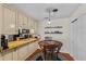 Cozy kitchen boasts granite countertops, wood floors, and a stylish breakfast nook with updated appliances at 188 Midlands Pkwy # 507, Summerville, SC 29485