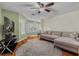 Inviting living room with hardwood floors, a comfortable sectional, and a ceiling fan at 188 Midlands Pkwy # 507, Summerville, SC 29485