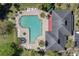 Overhead view of the community pool with surrounding lounge chairs and lush tropical landscaping at 188 Midlands Pkwy # 507, Summerville, SC 29485