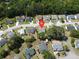 This aerial view shows a house in a neighborhood surrounded by lush trees and well-maintained landscaping at 203 Two Hitch Rd, Goose Creek, SC 29445